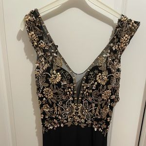 Stunning black Morilee prom dress with train.